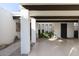 Expansive covered parking area with desert landscaping, modern design, and a welcoming entrance at 8720 E Via De Dorado --, Scottsdale, AZ 85258