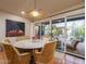 Bright dining area with wicker furniture, a unique light fixture, and views of the outdoor patio at 8720 E Via De Dorado --, Scottsdale, AZ 85258