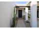 Inviting entryway with a secure front door, custom planters, and desert landscaping at 8720 E Via De Dorado --, Scottsdale, AZ 85258