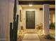 Welcoming front entrance with a secure door, monkey statues, and custom desert landscaping at 8720 E Via De Dorado --, Scottsdale, AZ 85258