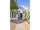 Welcoming front entrance with modern architecture, lush desert landscaping, and a secure gated entryway at 8720 E Via De Dorado --, Scottsdale, AZ 85258