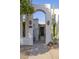 Charming front entrance featuring desert landscaping, modern design, and a secure gated entryway at 8720 E Via De Dorado --, Scottsdale, AZ 85258