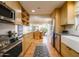 Bright kitchen with modern appliances, wooden cabinets, and open dining area at 8720 E Via De Dorado --, Scottsdale, AZ 85258