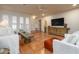Comfortable living room with a large TV, rustic wood accents, and stylish seating at 8720 E Via De Dorado --, Scottsdale, AZ 85258