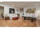 Spacious living room featuring neutral tones, decorative wall hangings and rustic wood accents at 8720 E Via De Dorado --, Scottsdale, AZ 85258