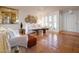Bright living room with terracotta floors, white sofas, and natural light, showcasing a modern bohemian aesthetic at 8720 E Via De Dorado --, Scottsdale, AZ 85258