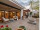 Relax in an inviting outdoor space featuring a cozy seating area, BBQ, and lush greenery at 8720 E Via De Dorado --, Scottsdale, AZ 85258