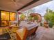 Relaxing patio featuring comfortable seating, a fire pit, and lush desert landscaping at 8720 E Via De Dorado --, Scottsdale, AZ 85258