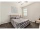 Comfortable bedroom featuring a neutral color scheme, a ceiling fan, and carpet flooring at 9404 E Grapefruit Dr, Florence, AZ 85132