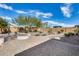 Inviting backyard features a paver patio and stone firepit, perfect for outdoor entertaining at 9952 W Jessie Ln, Peoria, AZ 85383