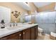 Stylish bathroom with a modern vanity, countertop, and a walk-in shower at 9952 W Jessie Ln, Peoria, AZ 85383