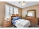 Comfortable bedroom with neutral walls, carpet flooring, and natural light at 9952 W Jessie Ln, Peoria, AZ 85383