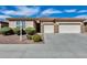 Charming single-story home featuring a three-car garage and a well-manicured front yard at 9952 W Jessie Ln, Peoria, AZ 85383