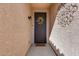 Welcoming entryway featuring a decorative wreath, security door, and a stylish welcome mat at 9952 W Jessie Ln, Peoria, AZ 85383