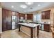 Beautiful kitchen with stainless steel appliances, a marble countertop island, and custom cabinetry at 9952 W Jessie Ln, Peoria, AZ 85383