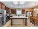 Spacious kitchen features stainless appliances, center island and an eat-in dining area at 9952 W Jessie Ln, Peoria, AZ 85383