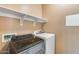 A laundry room featuring shelving and stainless steel machines at 9952 W Jessie Ln, Peoria, AZ 85383