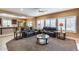 Open living area with comfortable seating, bright windows, and views to the kitchen at 9952 W Jessie Ln, Peoria, AZ 85383