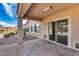 Covered patio is surrounded by desert landscaping and a beautiful blue sky at 9952 W Jessie Ln, Peoria, AZ 85383