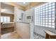 This bathroom features a frameless shower with marble walls and mosaic accents at 9952 W Jessie Ln, Peoria, AZ 85383