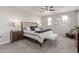 Cozy bedroom with neutral tones, ceiling fan, and ample natural light at 10054 E Bell Rd, Scottsdale, AZ 85260