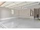 Spacious epoxy floor garage with water heater and storage racks at 10054 E Bell Rd, Scottsdale, AZ 85260