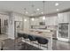 Modern kitchen with a large island, stainless steel appliances, and white cabinetry at 10054 E Bell Rd, Scottsdale, AZ 85260