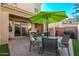 Inviting patio with outdoor seating and a dining area under a large umbrella at 10054 E Bell Rd, Scottsdale, AZ 85260