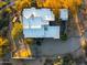 An aerial view of an estate showcasing the sprawling layout, multiple buildings, and desert landscaping at 10767 E Santa Fe Trl, Scottsdale, AZ 85262