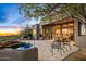 Charming back patio features a spa, outdoor seating, and a built-in BBQ with views of the beautiful Arizona landscape at 10767 E Santa Fe Trl, Scottsdale, AZ 85262