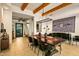 Elegant dining room showcasing a rustic table with seating for eight, stylish decor, and beamed ceilings at 10767 E Santa Fe Trl, Scottsdale, AZ 85262