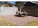 Outdoor patio features a brick paver floor, surrounded by block wall, and a dining table at 11406 W Montana Ave, Youngtown, AZ 85363