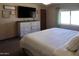 Bright bedroom with natural light, carpet flooring, and a white dresser at 11406 W Montana Ave, Youngtown, AZ 85363