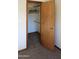 Bedroom closet with shelves and hanging rod for plenty of storage space at 11406 W Montana Ave, Youngtown, AZ 85363