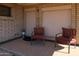 Welcoming front porch featuring seating area and neutral brickwork, offering curb appeal at 11406 W Montana Ave, Youngtown, AZ 85363