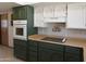 Functional kitchen featuring built-in oven, cooktop and ample counter space at 11406 W Montana Ave, Youngtown, AZ 85363