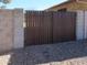 Side yard with a gated entrance at 11406 W Montana Ave, Youngtown, AZ 85363