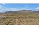 A sprawling desert landscape with distant mountain views and sparse vegetation at 12686 E Pivot Peak --, Gold Canyon, AZ 85118