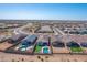 Wide aerial shot displays homes with pools and artificial turf in an expansive community setting against desert landscape at 12686 E Pivot Peak --, Gold Canyon, AZ 85118