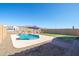 Scenic backyard featuring a sparkling pool with a waterfall feature, complemented by artificial turf and decorative rock at 12686 E Pivot Peak --, Gold Canyon, AZ 85118