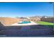 Expansive backyard with pool, lush turf, and scenic mountain views, great for entertaining at 12686 E Pivot Peak --, Gold Canyon, AZ 85118