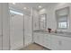 Modern bathroom with double vanity, a glass-enclosed shower, and neutral color palette at 12686 E Pivot Peak --, Gold Canyon, AZ 85118