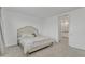 Relaxing bedroom with a tufted headboard, plush carpeting, and access to an ensuite bathroom at 12686 E Pivot Peak --, Gold Canyon, AZ 85118