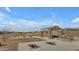 Community area with picnic tables, cornhole, and outdoor amenities for neighborhood social gatherings and recreation at 12686 E Pivot Peak --, Gold Canyon, AZ 85118