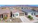 Exterior aerial view of a single-Gathering home with a tiled roof, desert landscaping, and a welcoming facade at 12686 E Pivot Peak --, Gold Canyon, AZ 85118