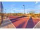 Outdoor tennis court with net and fencing, offering a recreational amenity for residents to enjoy sports activities at 12686 E Pivot Peak --, Gold Canyon, AZ 85118