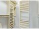 Walk-in closet with extensive shelving and storage solutions, designed to maximize space at 12706 W Shadow Hills Dr, Sun City West, AZ 85375