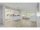 Bright and open kitchen featuring stainless steel appliances, breakfast bar, and view to sun room at 12706 W Shadow Hills Dr, Sun City West, AZ 85375