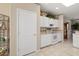 Bright kitchen featuring white cabinetry and ample storage at 15542 W Cypress Point Dr, Surprise, AZ 85374