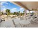 Enjoy outdoor living on this covered patio with ceiling fan and relaxing views of the desert landscape at 15542 W Cypress Point Dr, Surprise, AZ 85374